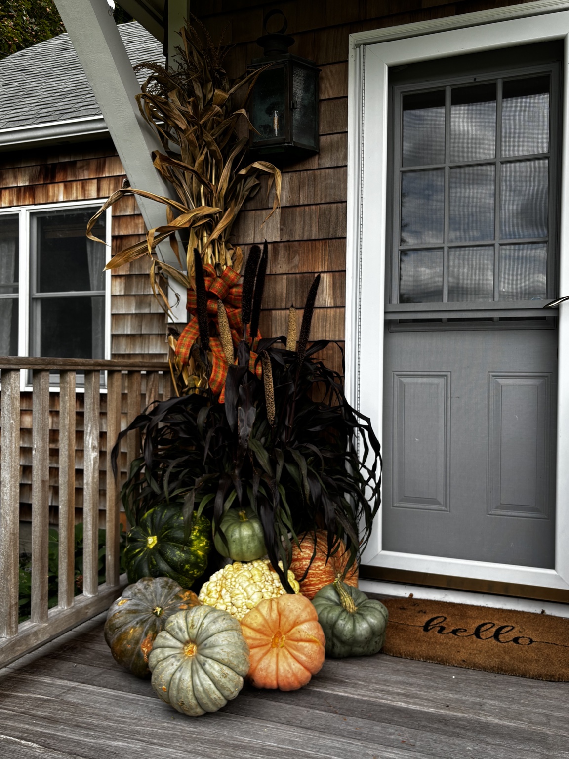 Cornstalk and pumpkin porch display